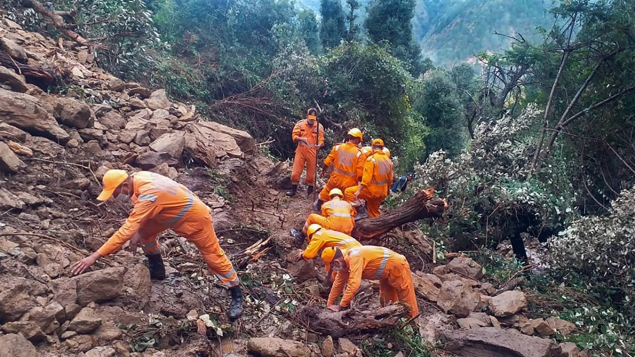 National Disaster Response Force (NDRF) personnel carry out rescue operations in a landslide-affected area following heavy rains in Dungree village of Chamoli district. Credit: PTI Photo/NDRF Handout