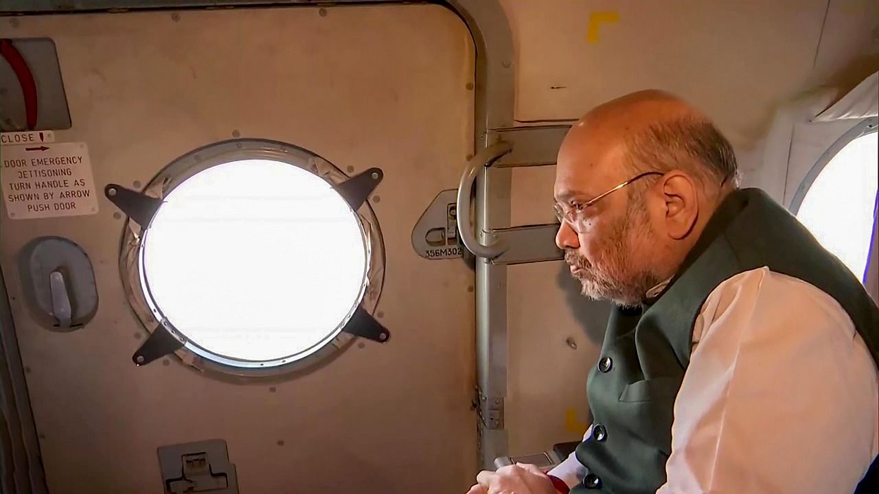 Union Home Minister Amit Shah conducts an aerial survey of flood and landslide affected areas of Uttarakhand following heavy rains. Credit: PTI Photo