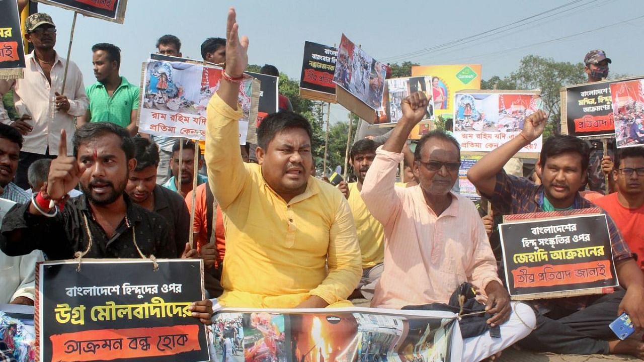 BJP activists participate in a rally to protest against the alleged attack on Hindu community in Bangladesh, in Malda. Credit: PTI Photo