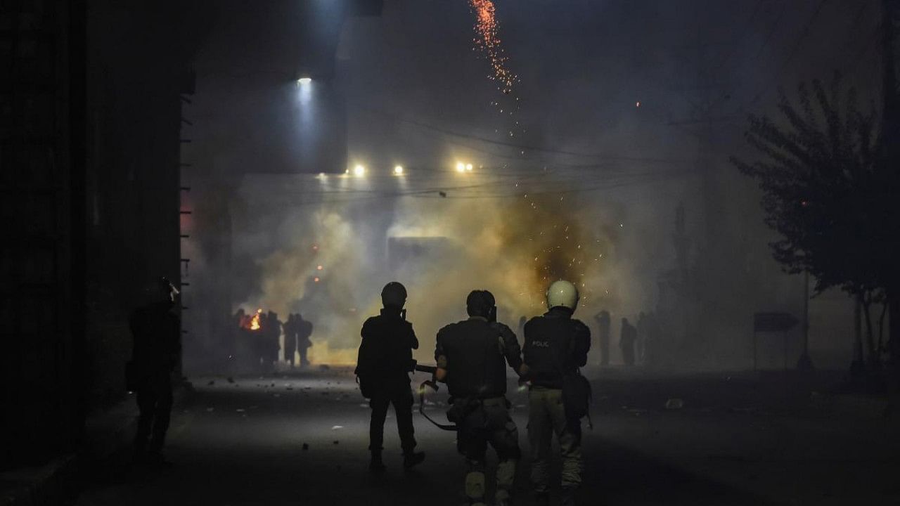 Police fire teargas shells on the supporters of Tehreek-e-Labbaik Pakistan(TLP) party during a march towards capital Islamabad from Lahore. Credit: AFP Photo