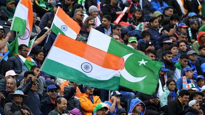 Spectators wave flags during the 2019 Cricket World Cup group stage match between India and Pakistan. Credit: AFP Photo