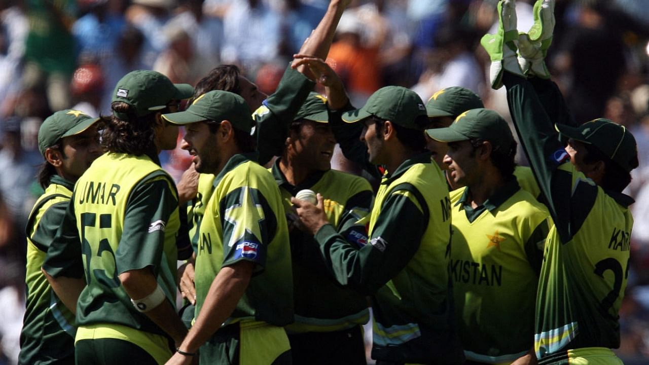 In this file photo taken on September 24, 2007, Pakistani cricket team players celebrate the dismissal of Indian batsman Yousuf Pathan (not in picture) during the final match of the World Twenty20 championship at the Wanderers Cricket Stadium in Johannesburg. Credit: AFP file photo