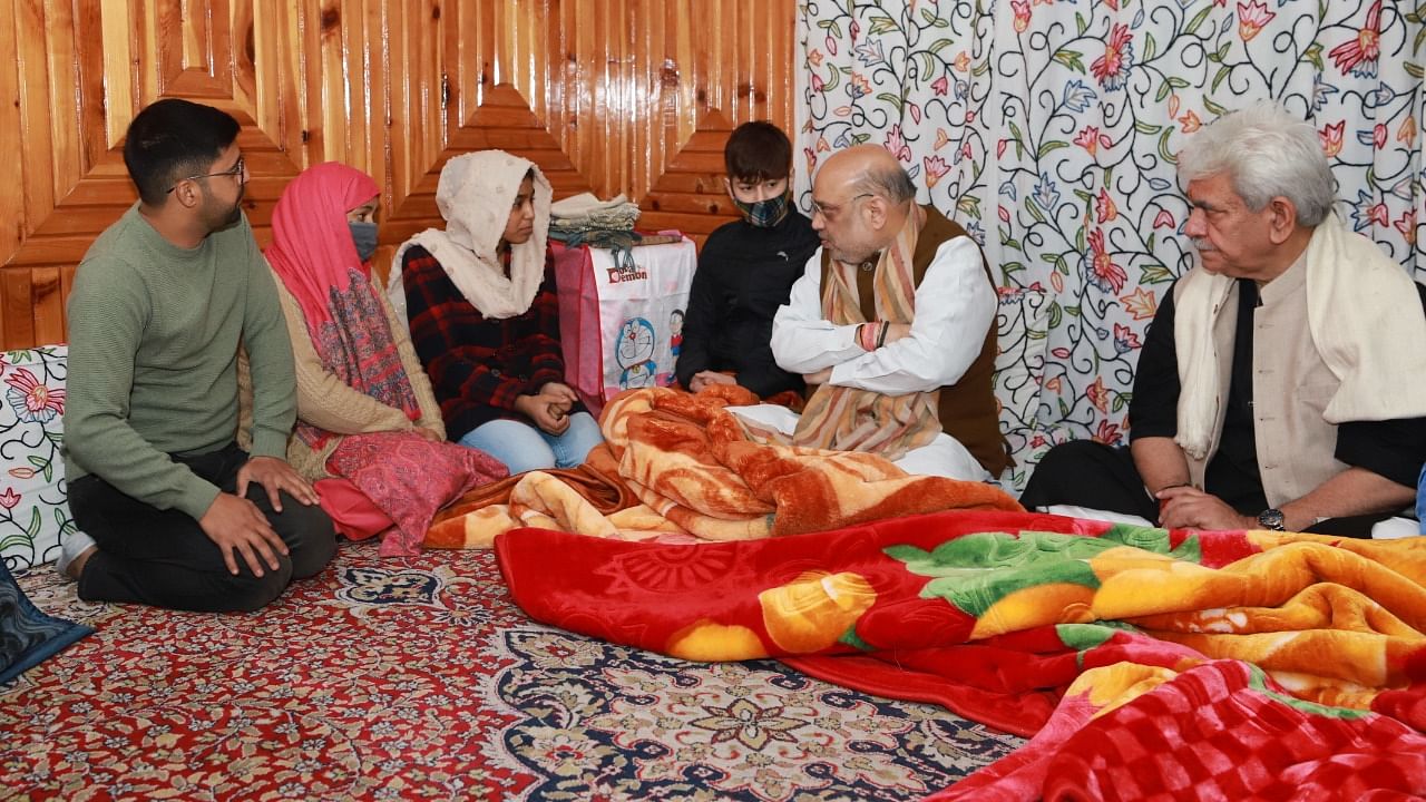 Union Home Minister Amit Shah visits the residence of martyr J&K Police, Inspector Parvez Ahmed. Credit: Twitter/@AmitShah