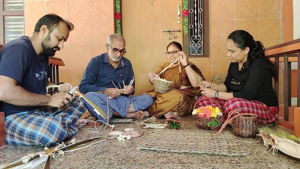 Thirumala Sharma T L (second from left) and his family engaged in weaving baskets from areca leaves; (top) baskets made from areca leaves.