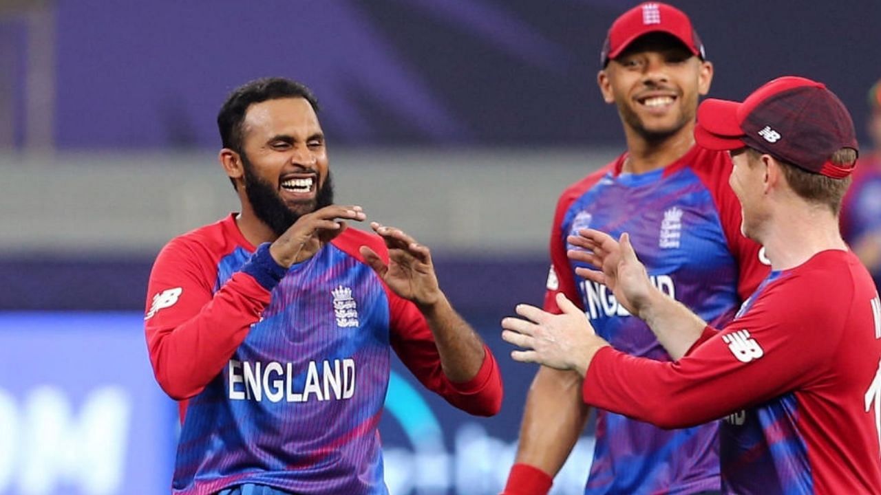 England's Adil Rashid celebrates with teammates after taking the wicket to dismiss West Indies' Obed McCoy. Credit: Reuters Photo