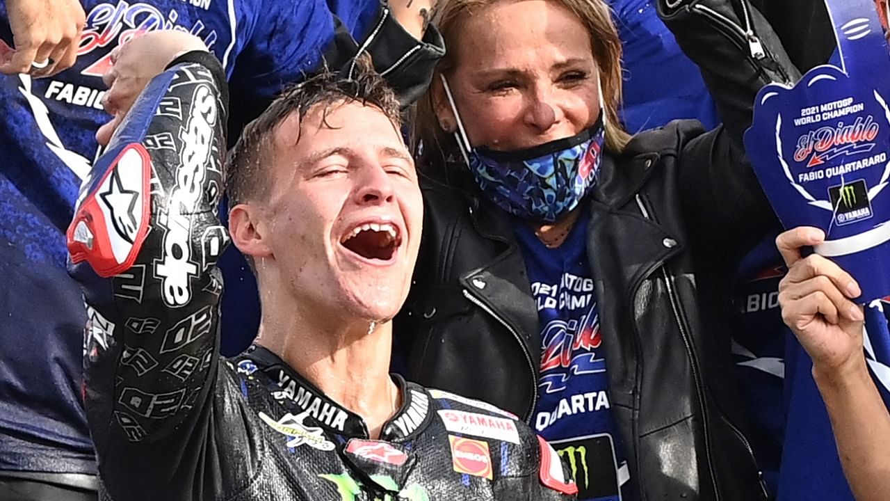 Yamaha French rider Fabio Quartararo (L) celebrates his world champion title. Credit: AFP Photo