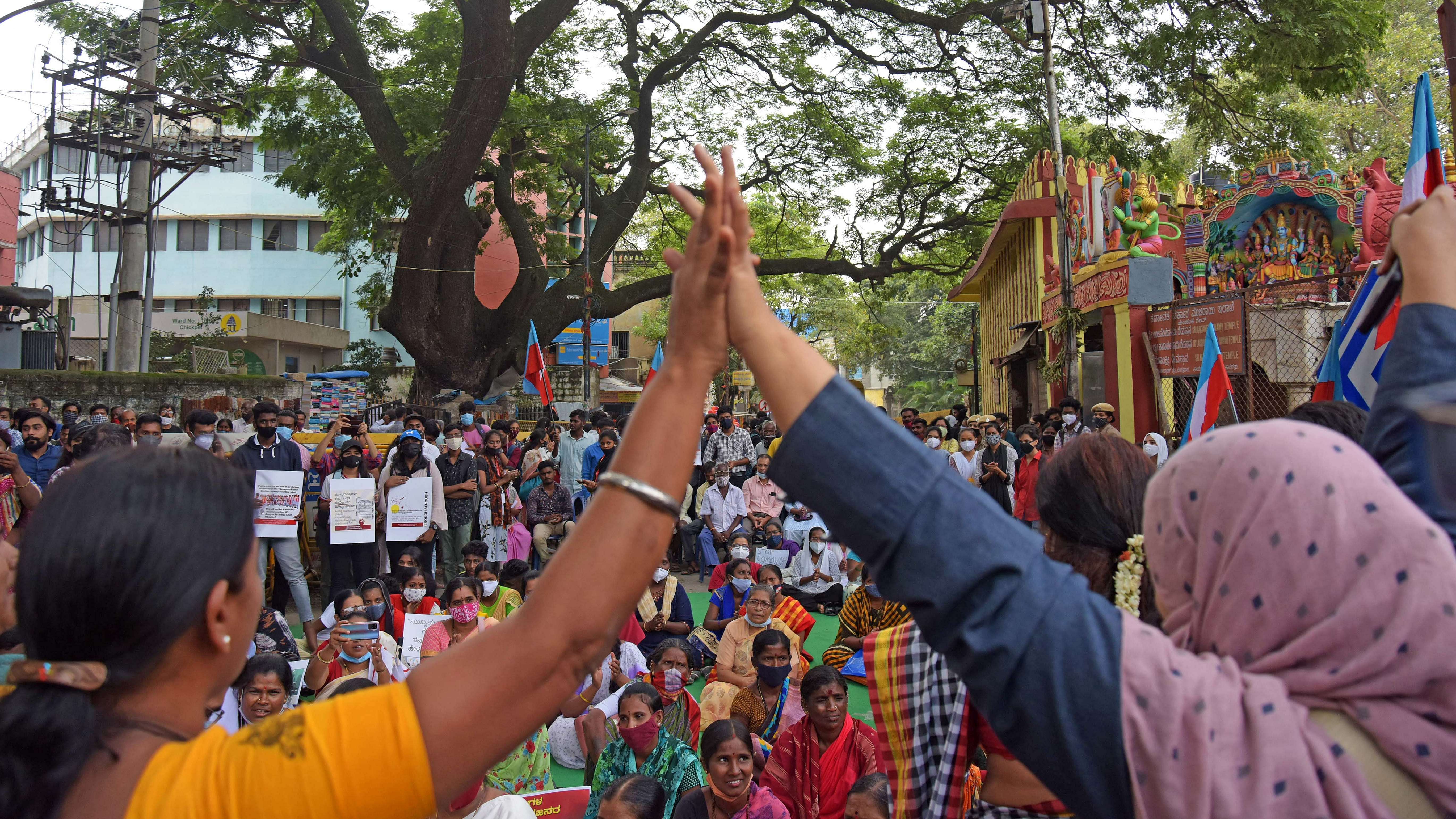 People from various organisations and citizen rights activists came together at SBM circle on Thursday condemning communal violence and demanding that the Chief Minister take back his 'action - reaction' statement on moral policing, in Bengaluru. Credit: DH Photo/ Pushkar V