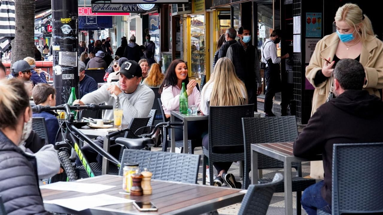 Diners eat outside St Kilda's Rococo restaurant on the second day of eased coronavirus disease (COVID-19) regulations, following a lockdown to curb an outbreak, in Melbourne. Credit: Reuters Photo