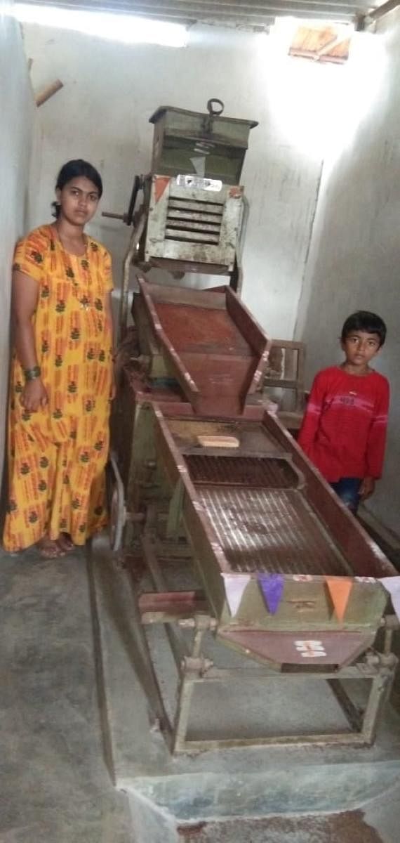 Deekshith and his mother Arpitha, at the flour mill.