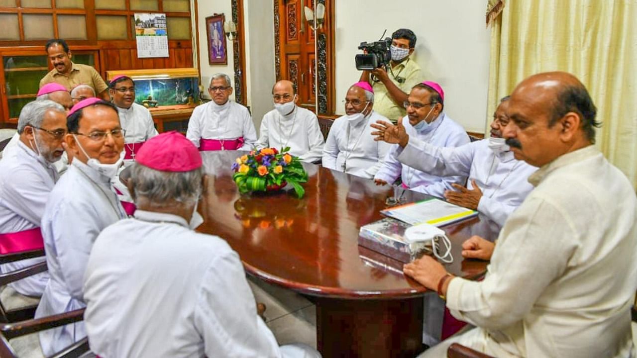File Photo of CM Bommai meeting Archbishop Peter Machado and team at Vidhana Soudha in Bengaluru. Credit: DH Photo