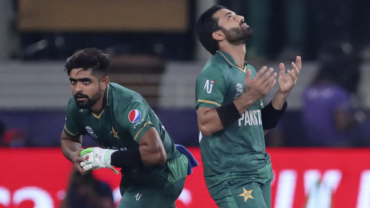 Pakistan's cricket captain Babar Azam, left, and Mohammad Rizwan celebrate their victory in the Cricket Twenty20 World Cup match between India and Pakistan in Dubai. Credit: AP Photo