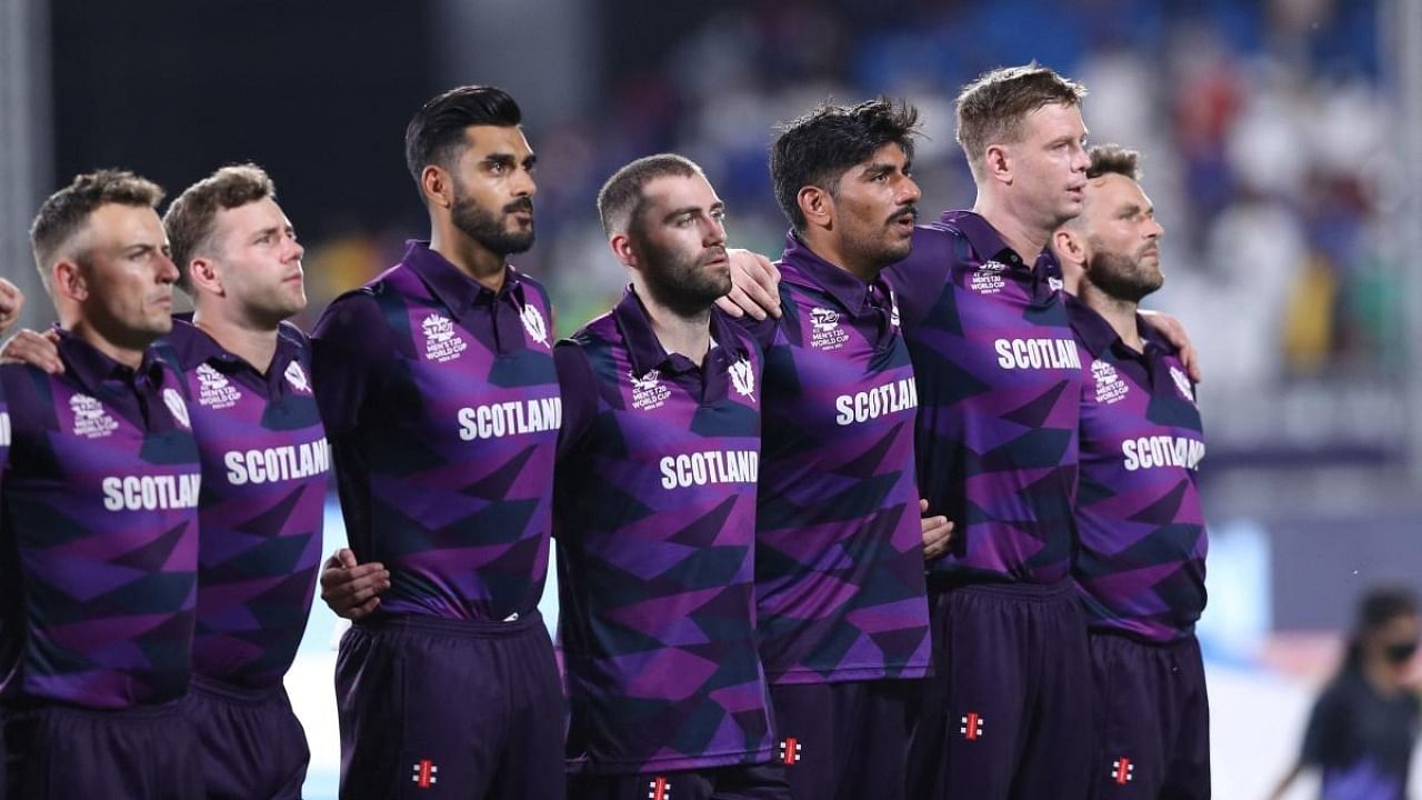 Scotland's players stand for the national anthem before the start of the ICC men's Twenty20 World Cup cricket match between Oman and Scotland at the Oman Cricket Academy Ground. Credit: AFP File photo