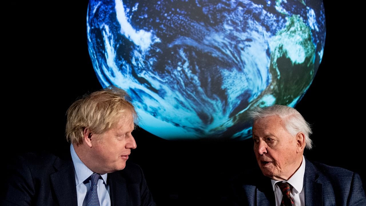 British Prime Minister Boris Johnson and David Attenborough (R). Credit: Reuters Photo