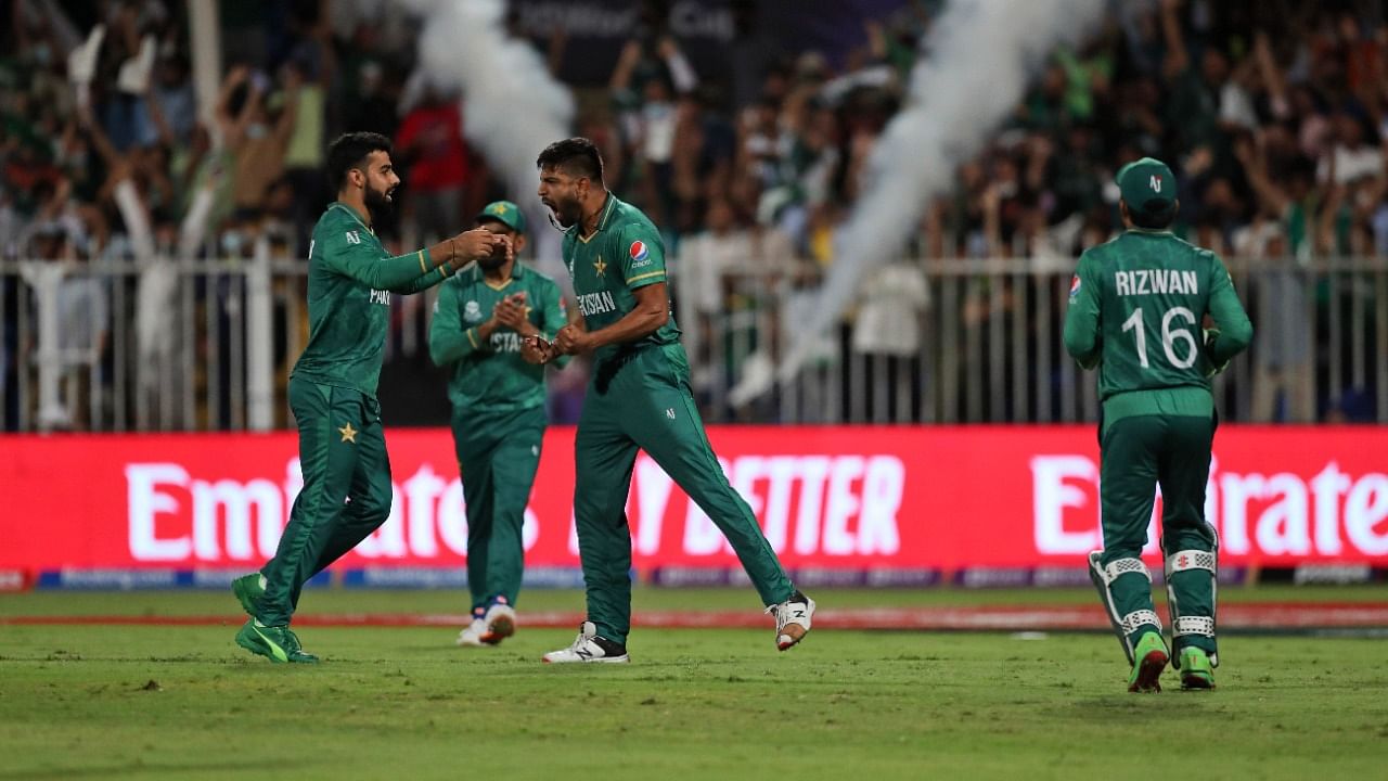 Pakistan's Haris Rauf celebrates the dismissal of New Zealand's Martin Guptill during the Cricket Twenty20 World Cup match between New Zealand and Pakistan in Sharjah, UAE, Tuesday. Credit: AP/PTI Photo