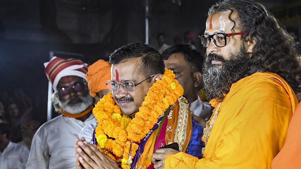 Delhi Chief Minister and AAP national convener Arvind Kejriwal being felicitated while performing 'Aarti' at Saryu Ghat in Ayodhya. Credit: PTI Photo