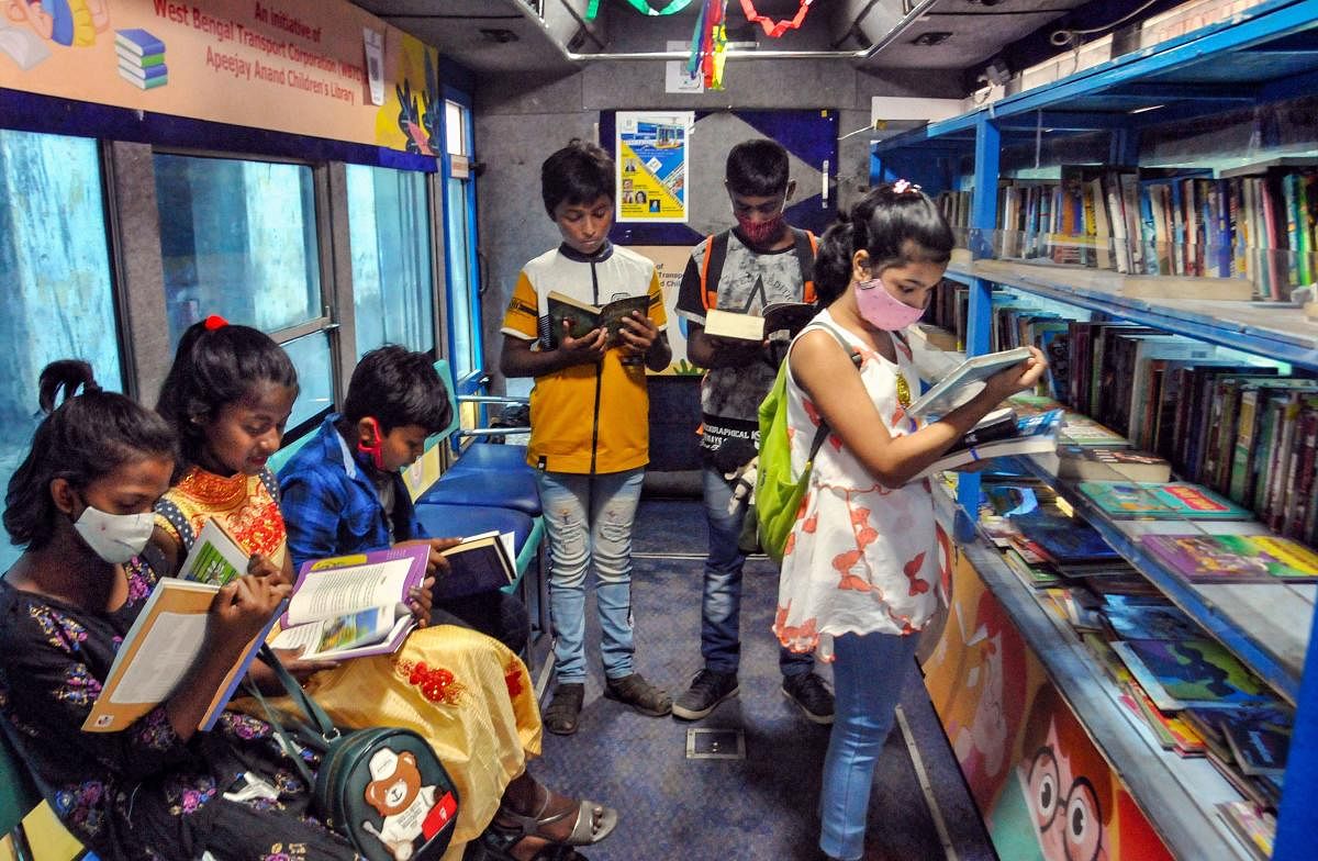 Children in a tram library in Kolkata. PTI 