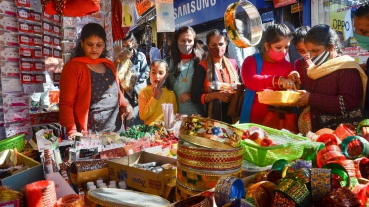 Women shop at a market ahead of Karva Chauth. Credit: PTI File Photo