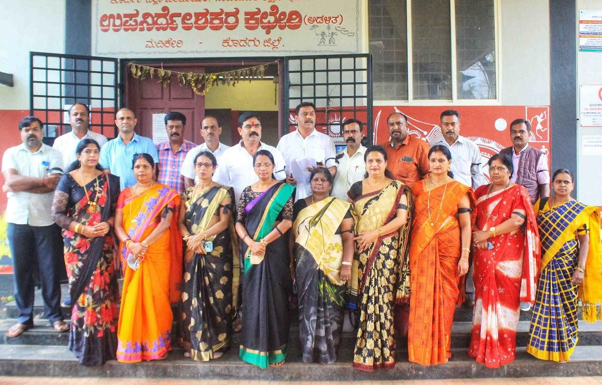 Teachers stage a protest in front of the DDPI’s office in Madikeri. 