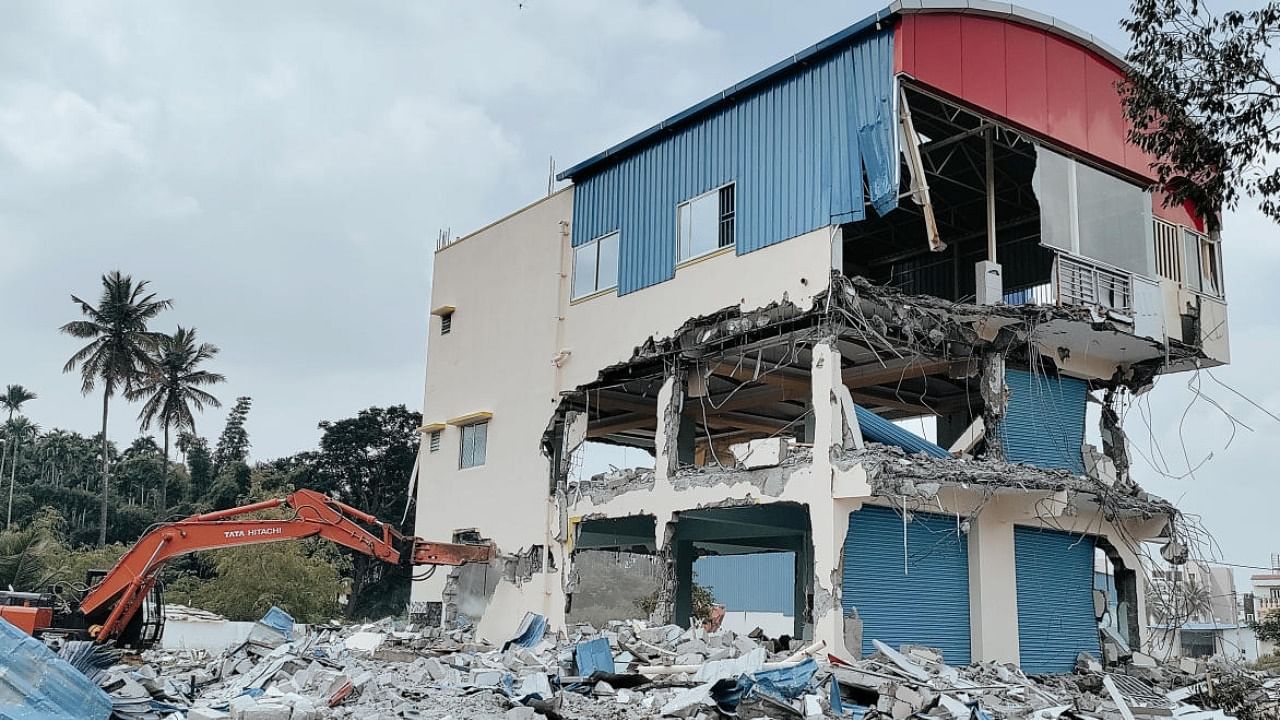 One of the four RCC buildings pulled down by the BDA in Dr Shivaram Karanth Layout near Dasarahalli on Monday. Credit: DH Photo