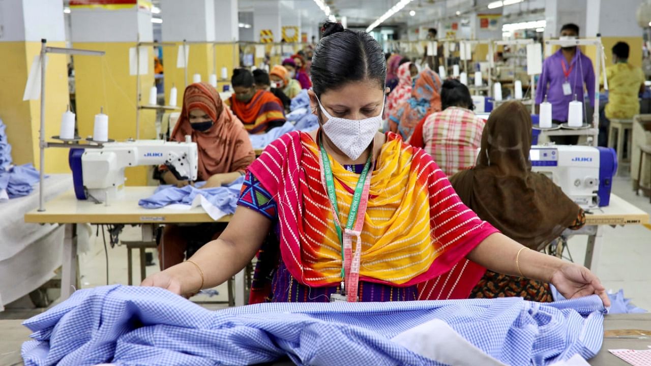 A woman works in a garment factory, as factories reopened after the government has eased the restrictions amid concerns over coronavirus disease outbreak in Dhaka, Bangladesh, May 3, 2020. Credit: Reuters Photo