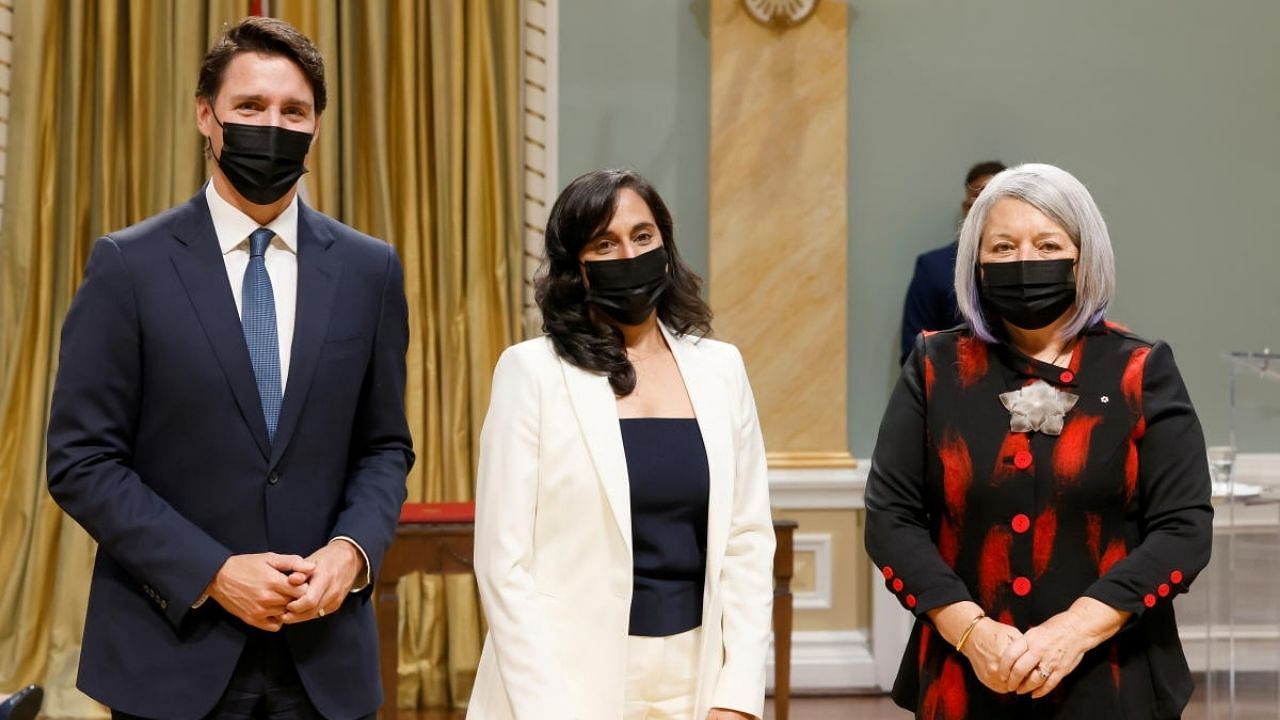 Canada's Prime Minister Justin Trudeau (L) and Governor General Mary May Simon (R) pose with Minister of National Defence Anita Anand (C) during the cabinet's swearing-in ceremony at Rideau Hall in Ottawa. Credit: Reuters Photo