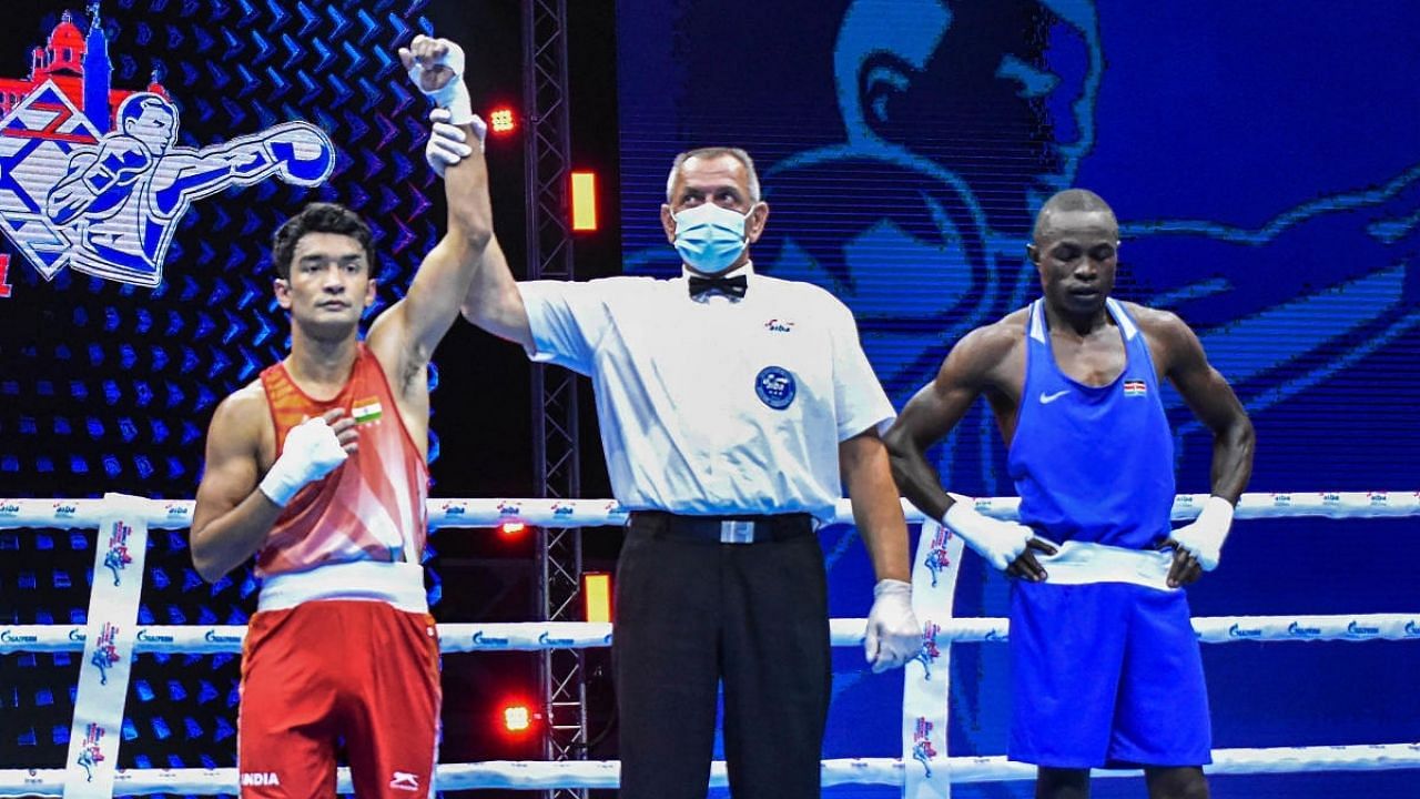 Indian boxer Shiva Thapa (Red) wins at the 2021 AIBA World Boxing Championships against Kenya’s Victor Nyadera (Blue) in the 63.5kg round-of-64 match. Credit: PTI Photo