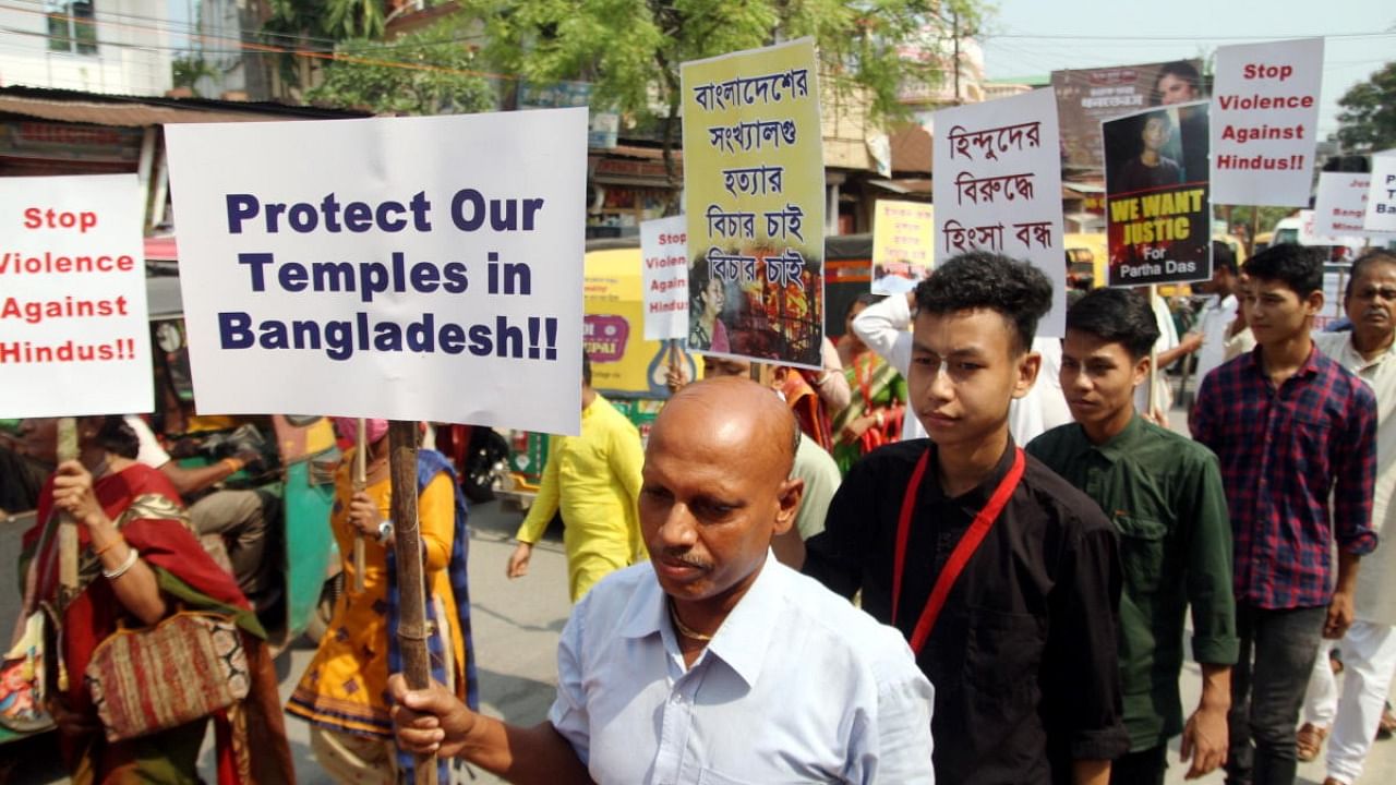 International Society for Krishna Consciousness (ISKCON) members participate in a rally to protest against the alleged attack on Hindu community in Bangladesh. Credit: PTI Photo