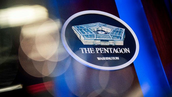 The Pentagon logo is seen behind the podium in the briefing room at the Pentagon in Arlington. Credit: Reuters File Photo