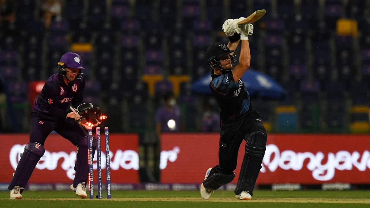 Namibia's captain Gerhard Erasmus (R) is bowled out by Scotland's Michael Leask (not pictured) during the ICC men’s Twenty20 World Cup cricket match between Scotland and Namibia at the Sheikh Zayed Cricket Stadium in Abu Dhabi on October 27, 2021. Credit: AFP Photo