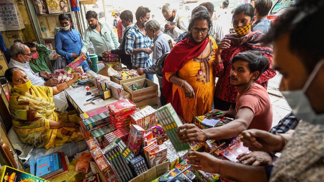People visit a firecrackers' shop, ahead of the Diwali festival, near Jama Masjid in old Delhi. Credit: PTI file photo