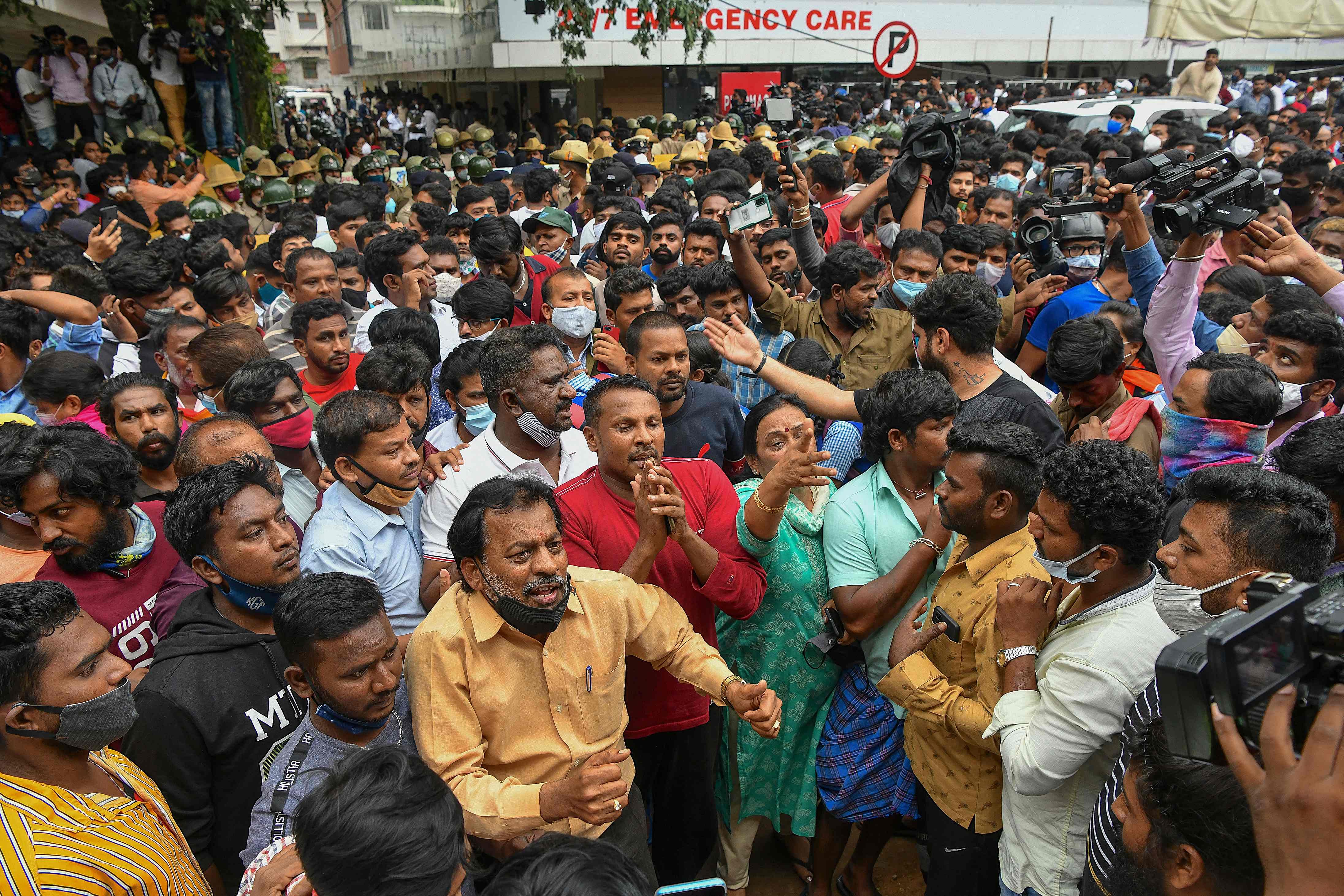 Public and fans of Kannada cinema actor Puneeth Rajkumar outside the hospital. Credit: AFP Photo