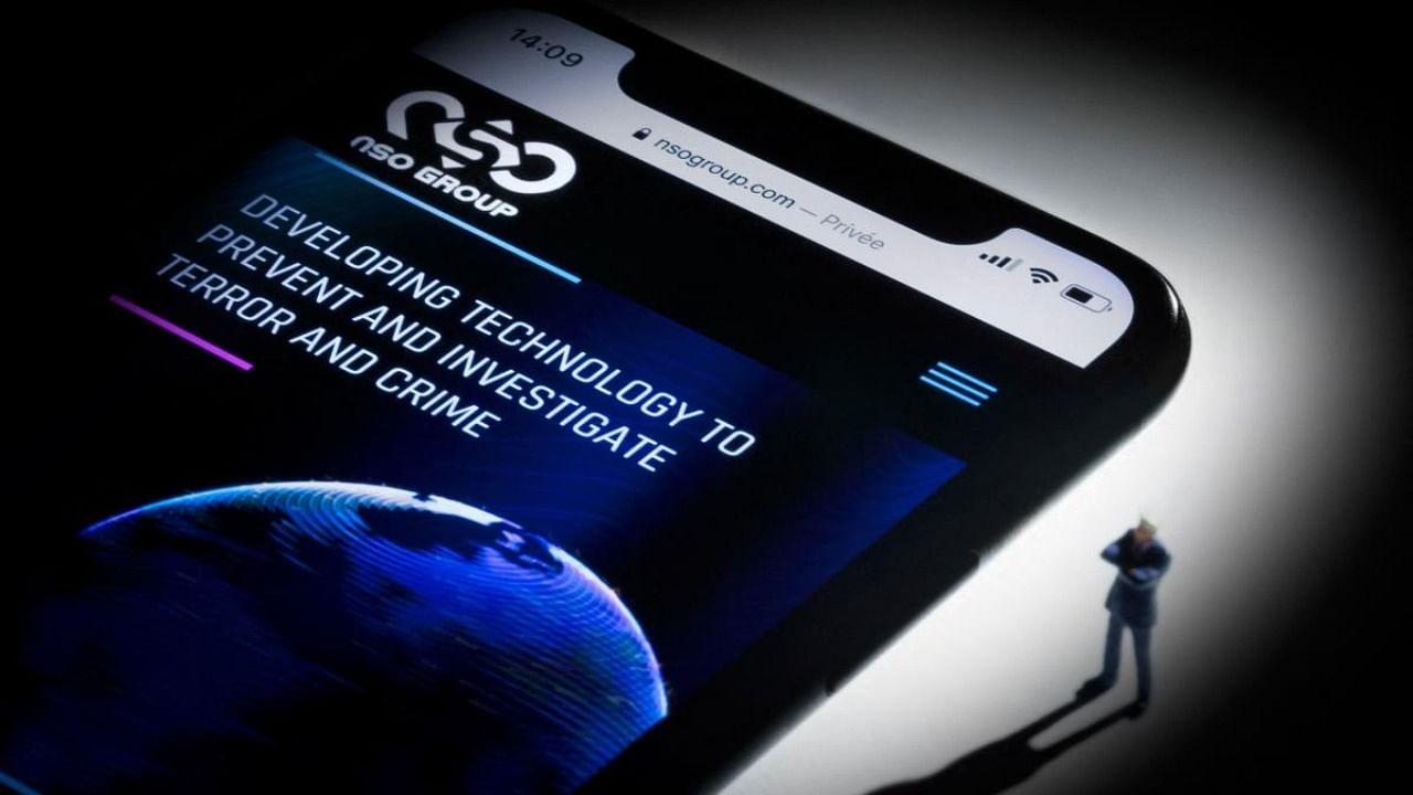 This file studio photographic illustration shows a smartphone with the website of Israel's NSO Group which features 'Pegasus' spyware, on display. Credit: AFP File Photo