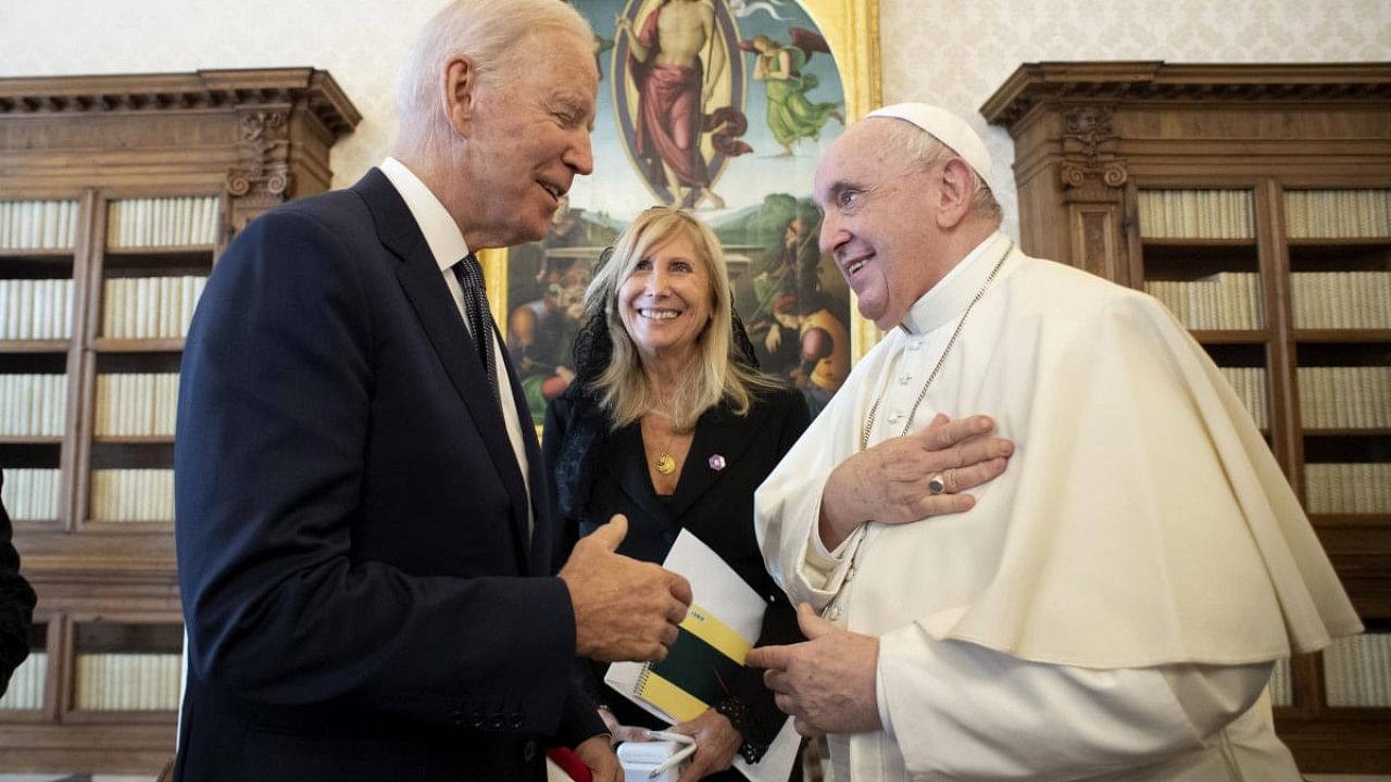  US President Joe Biden, left, talks to Pope Francis as they meet at the Vatican. Credit: AP Photo