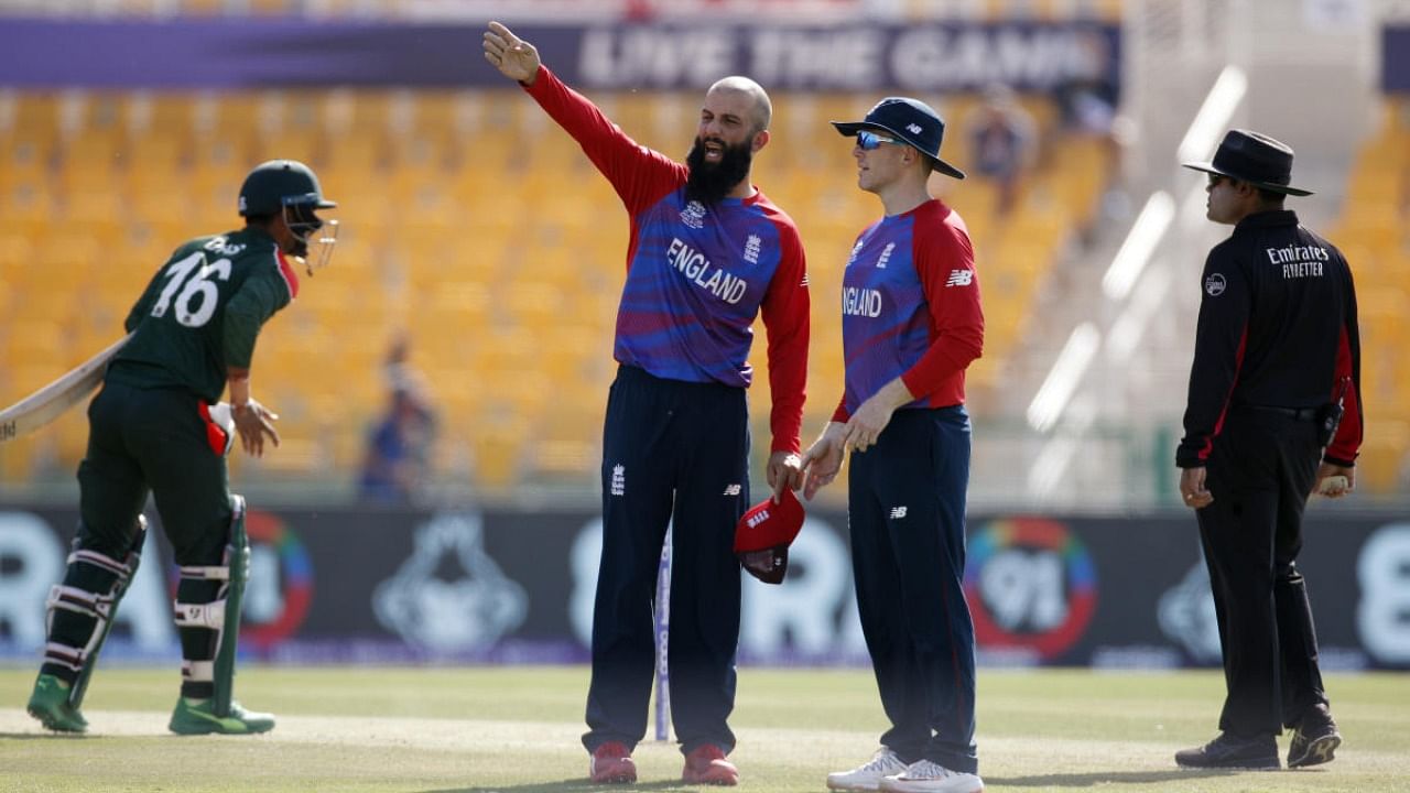 England's Moeen Ali with Eoin Morgan. Credit: Reuters photo