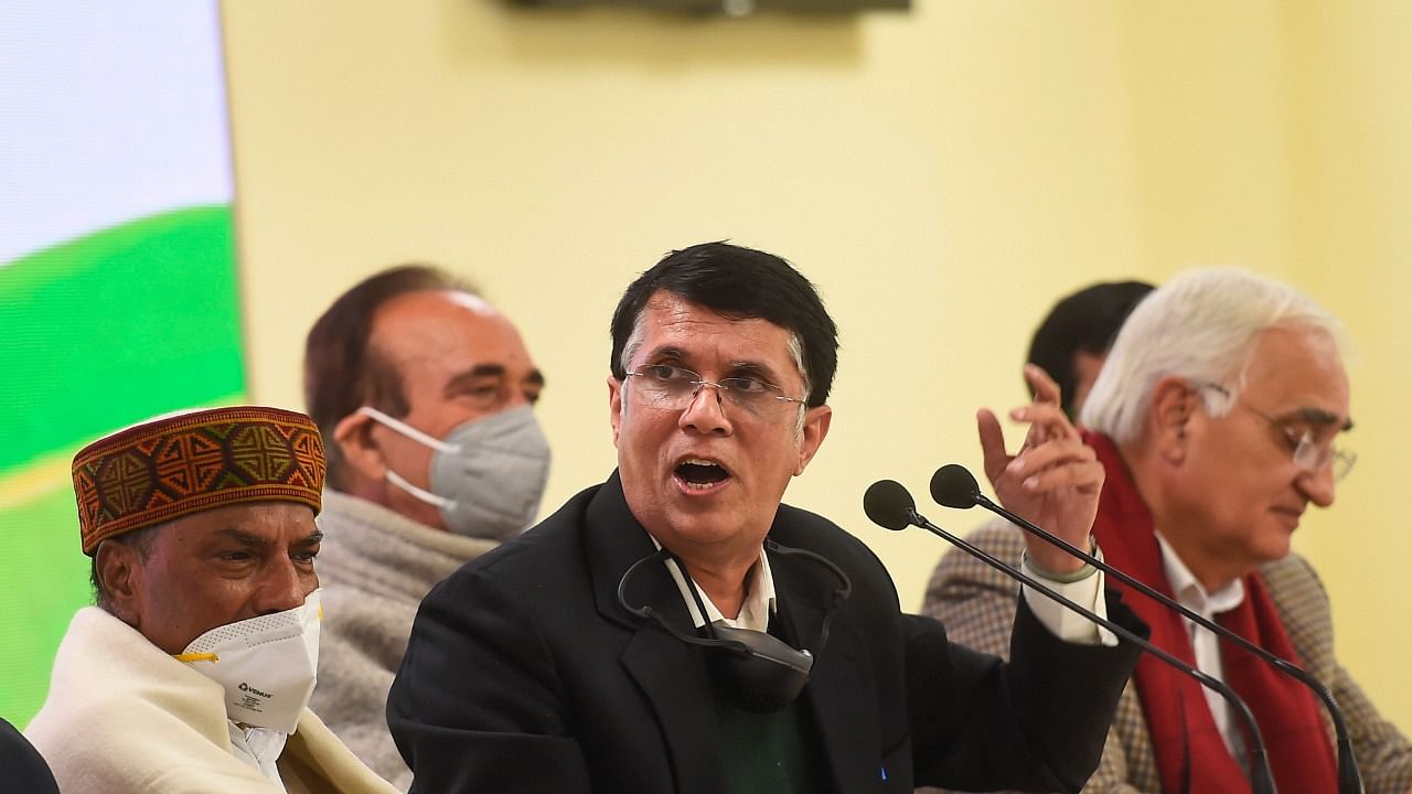 Congress spokesperson Pawan Khera (C). Credit: PTI file photo