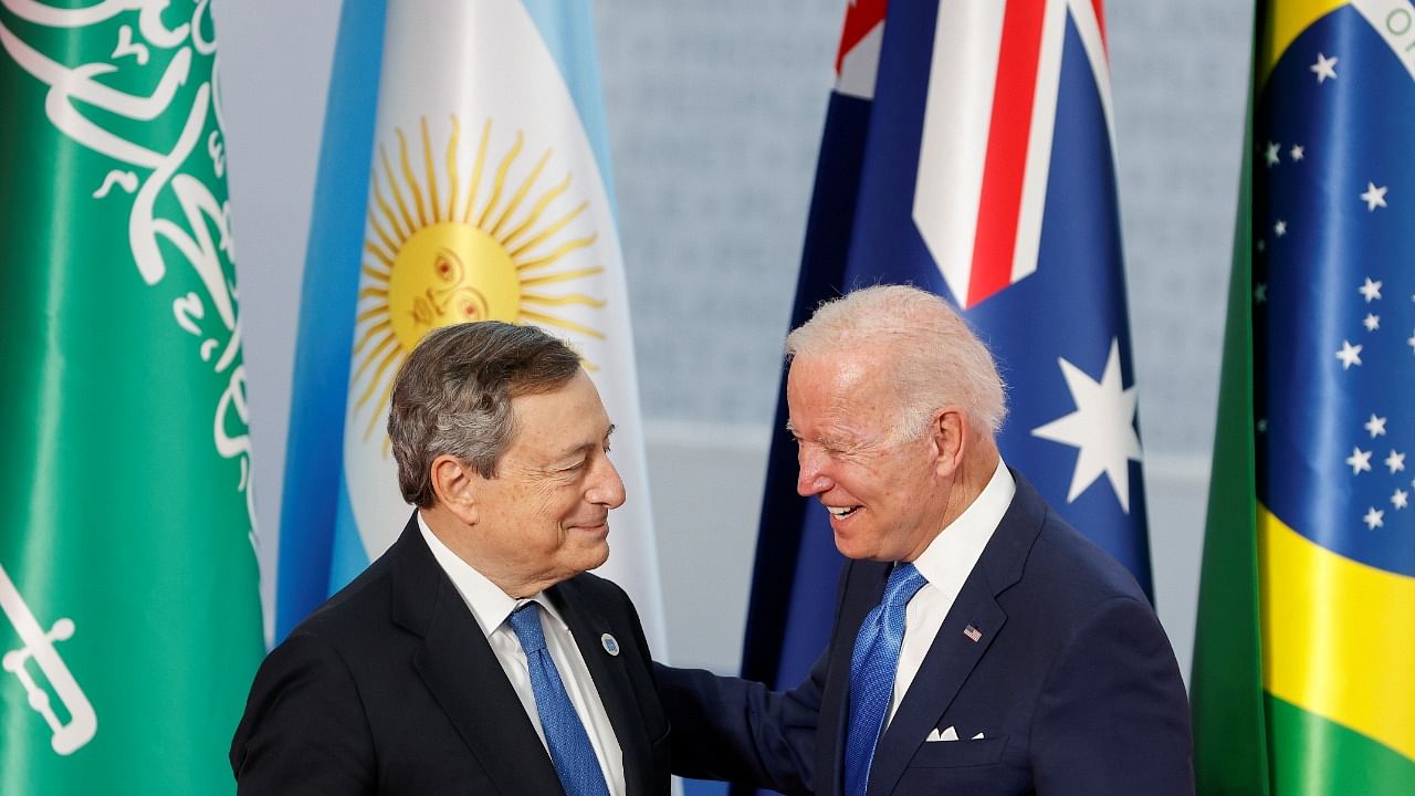 Italy's Prime Minister Mario Draghi greets US President Joe Biden as he arrives for the G20 leaders summit. Credit: Reuters Photo