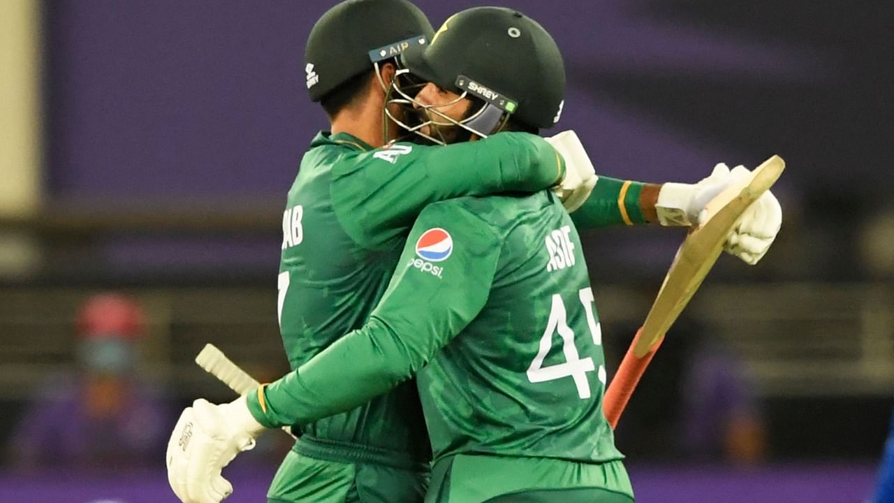 Pakistan's Shadab Khan (L) and Asif Ali celebrate their win in the ICC men’s Twenty20 World Cup cricket match between Afghanistan and Pakistan at the Dubai International Cricket Stadium in Dubai. Credit: AFP File Photo