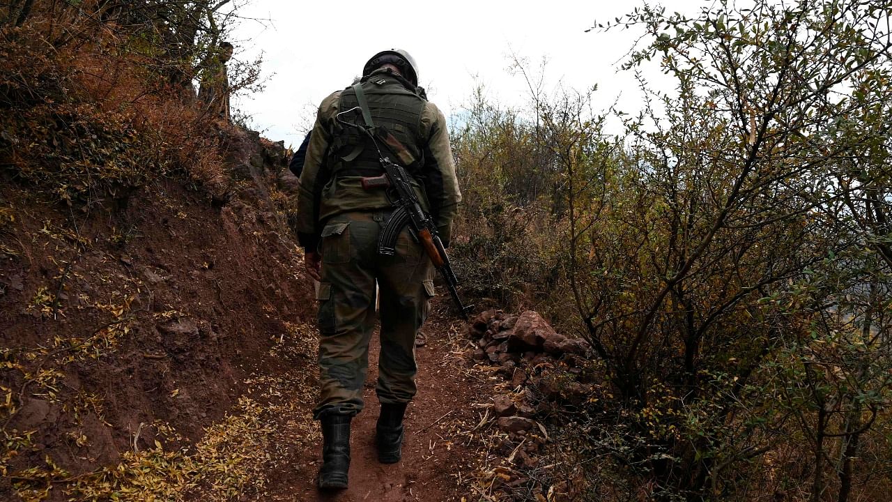 Soldier patrols at a village near Line of Control in Jammu. Credit: AFP File Photo