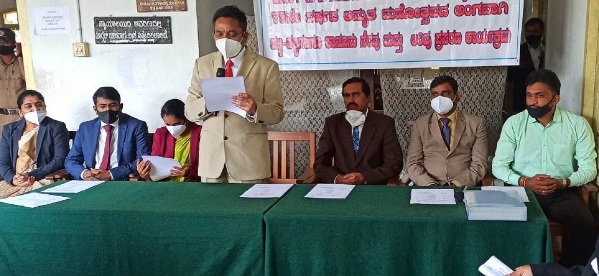 Principal District and Sessions Court Judge B L Jinaralakar speaks during an awareness programme at the district court premises in Madikeri. 