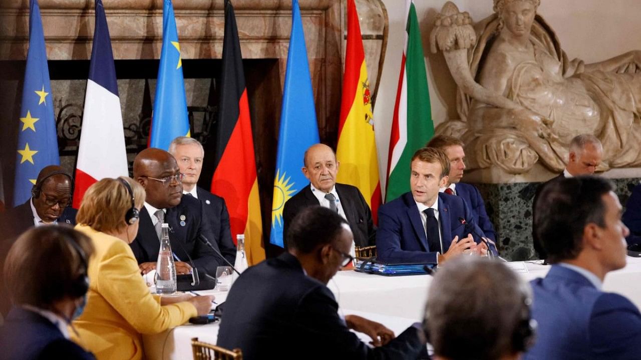 French President Emmanuel Macron (R) chairs a meeting with leaders of the African Union and European Union at the Palazzo Farnese. Credit: AFP Photo