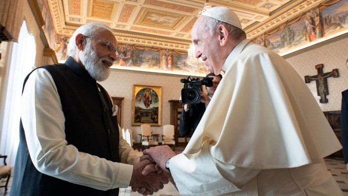 Pope Francis (R) and Indian Prime Minister Narendra Modi (L). Credit: AFP File Photo