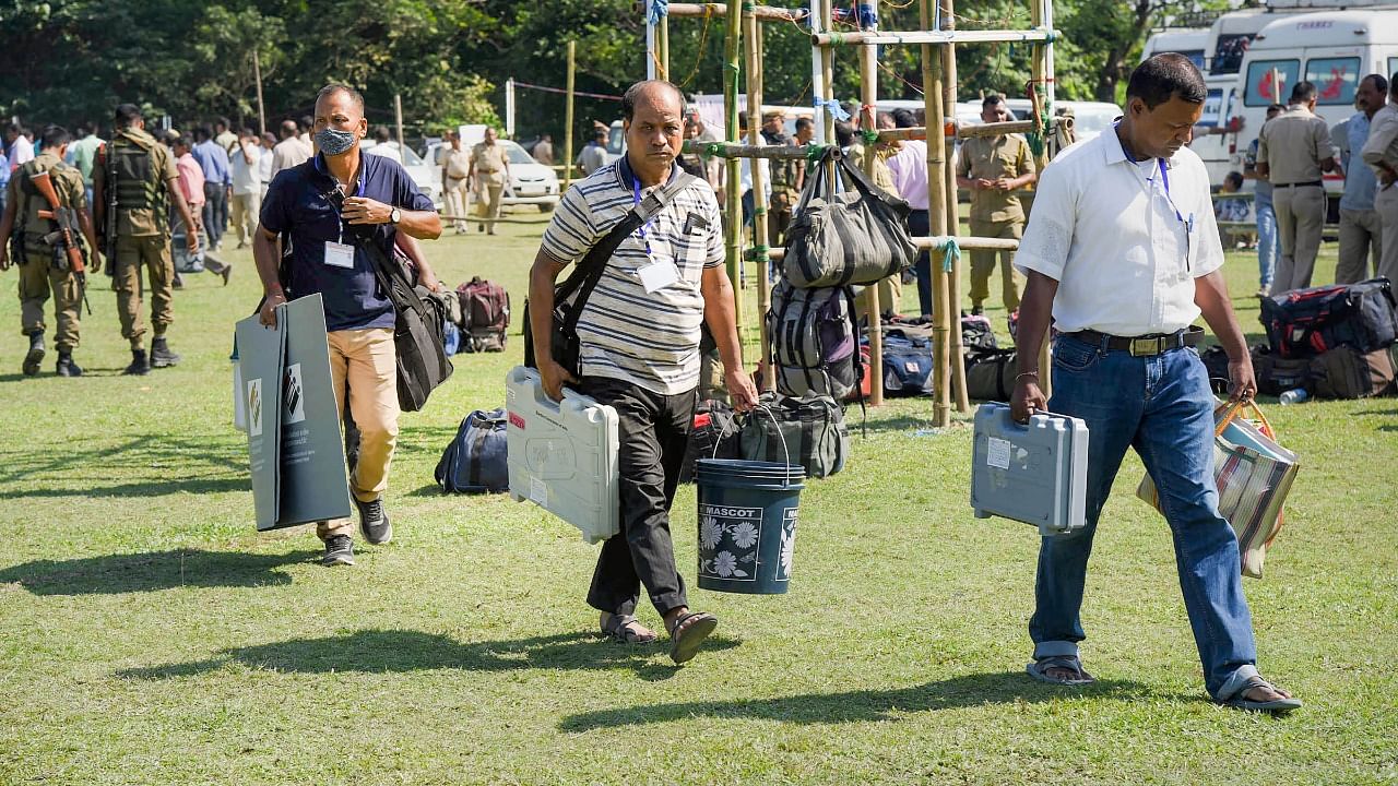 Election officials carrying EVMs leave for polling stations on the eve of bypolls to Musalpur seat, in Baksa district. Credit: PTI Photo
