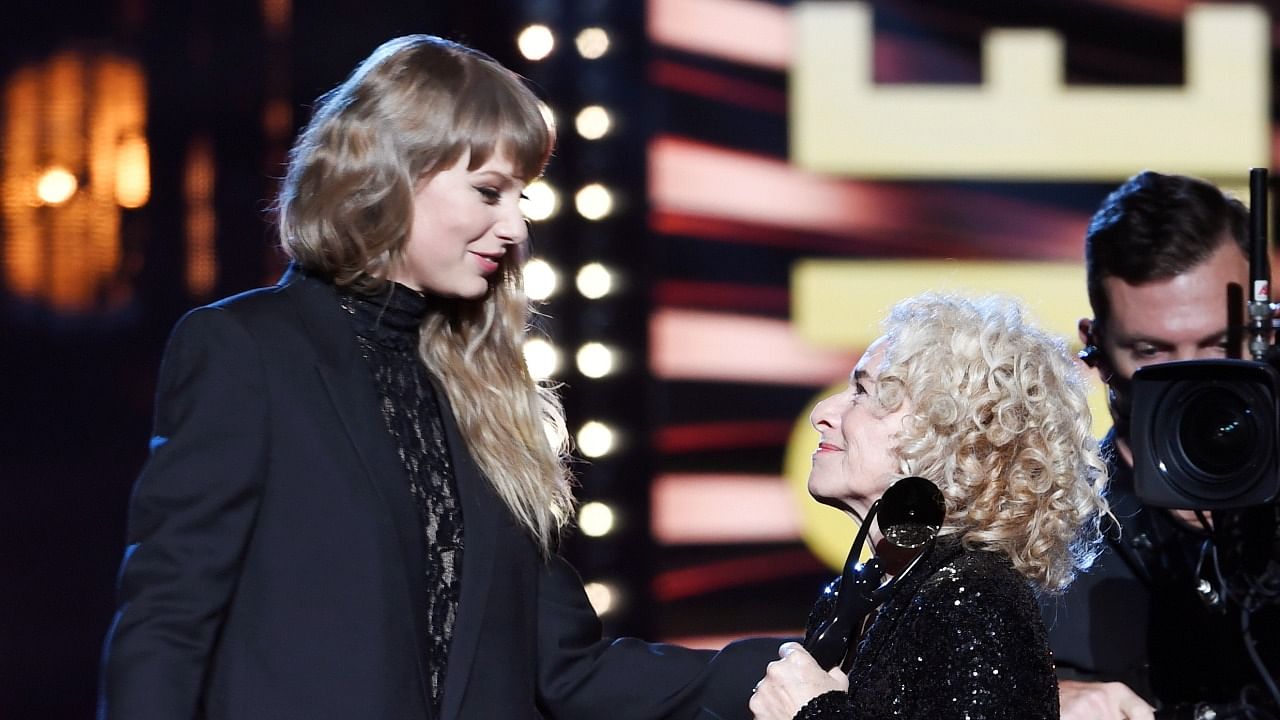 Taylor Swift introduces Carole King as King is inducted into the Rock and Roll Hall of Fame, in Cleveland, Ohio, US. Credit: Reuters Photo