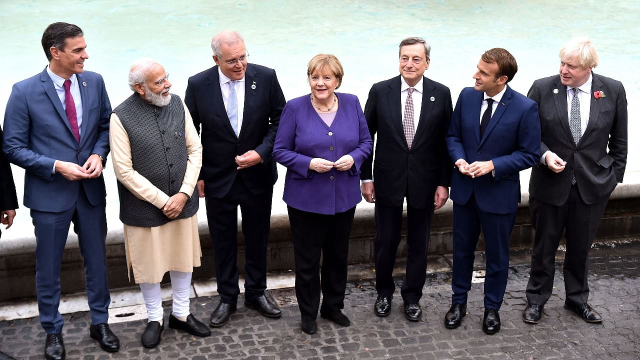 PM Modi (2nd from left) stands alongside other G20 leaders at the Trevi Fountain in Rome. Credit: AFP Photo