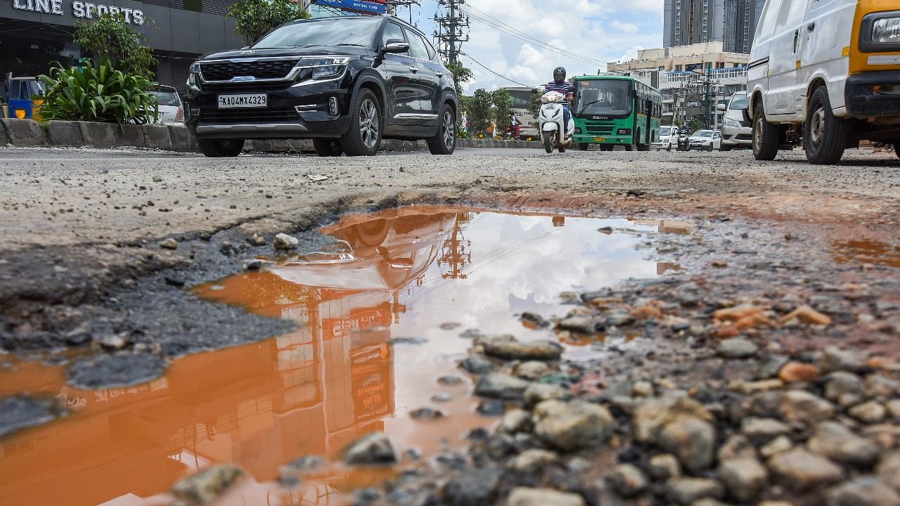 TenderSURE or otherwise, most of Bengaluru's roads are riddled with potholes. Credit: DH File Photo