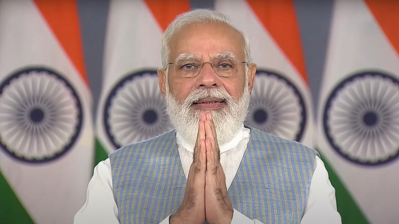 Prime Minister Narendra Modi gestures while addressing the Rashtriya Ekta Diwas function at the Statue of Unity via video conferencing. Credit: PTI Photo