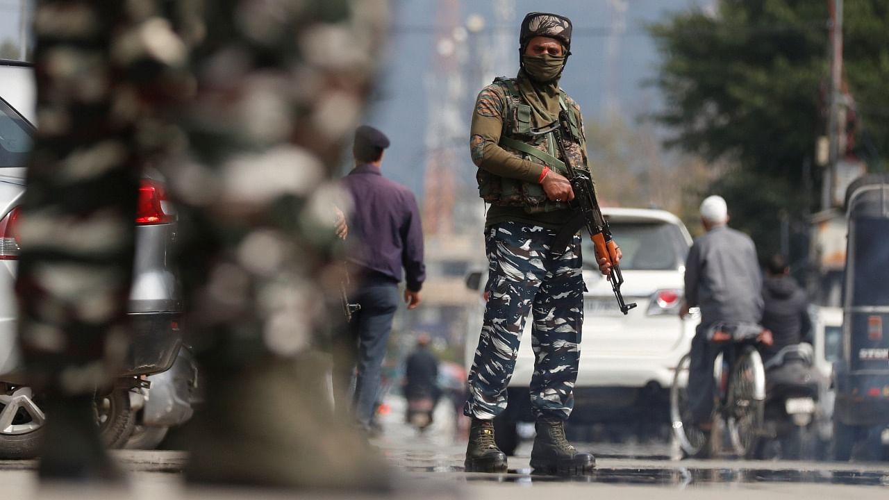 CRPF personnel stand guard on a street in Srinagar. Credit: Reuters File Photo
