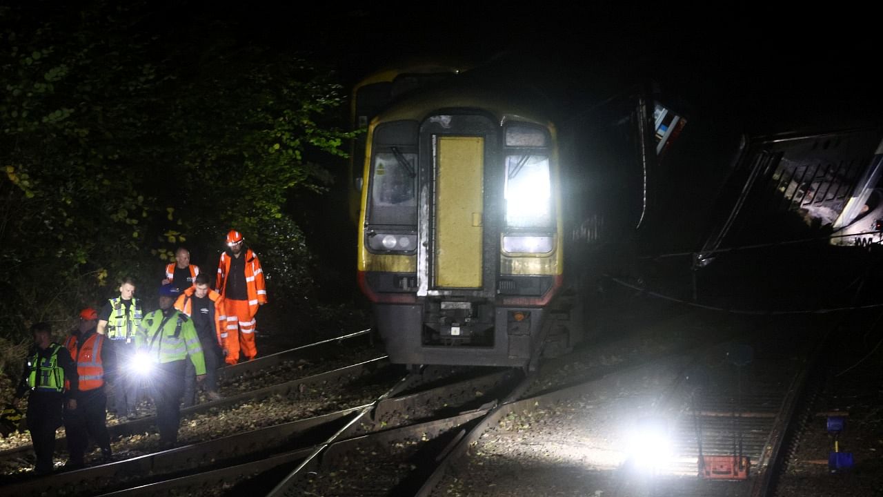 Police and emergency services personnel work at the site where two trains collided near Salisbury, Britain. Credit: Reuters Photo