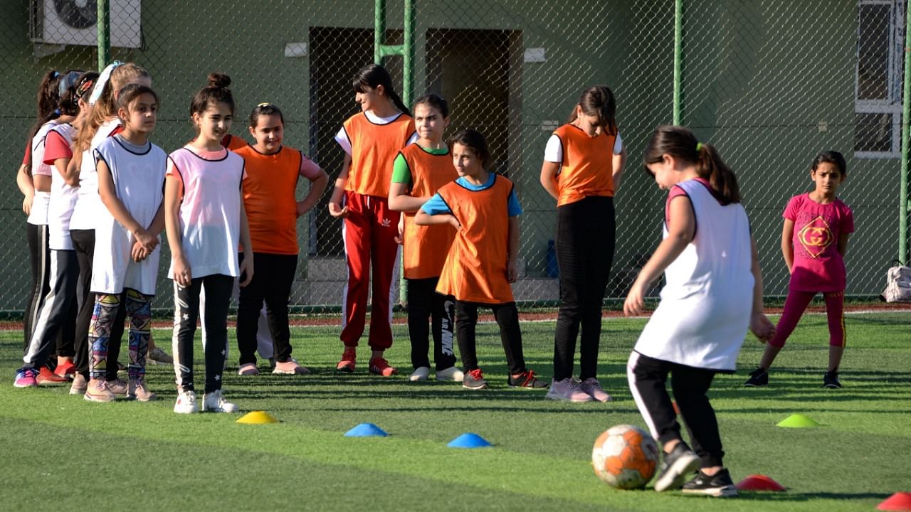Iraqi girls take part in a training session at the Bartalla sports club. Credit: AFP Photo