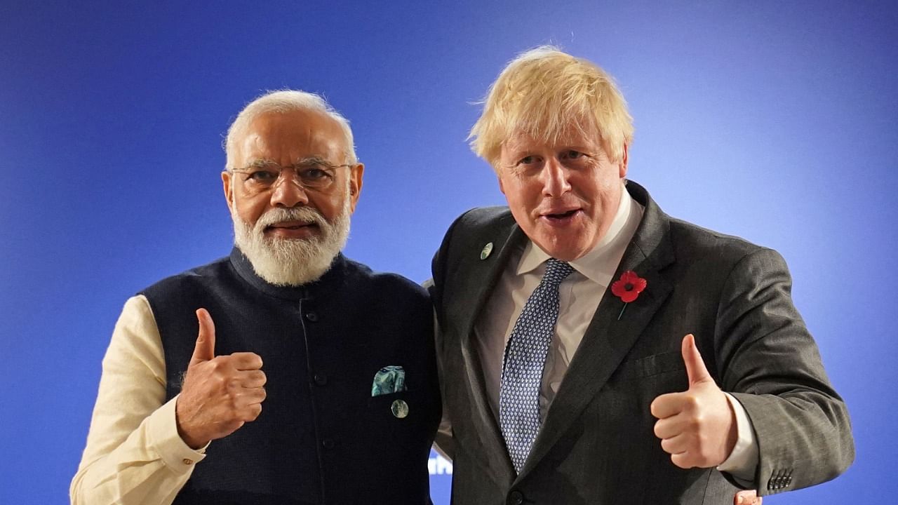 Britain's Prime Minister Boris Johnson (R) and India's Prime Minister Narendra Modi. Credit: AFP Photo